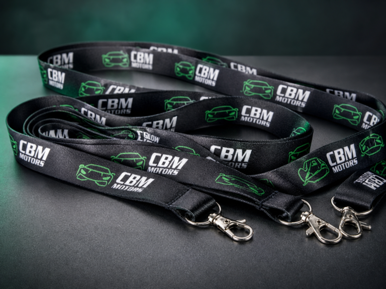 Custom CBM Motors business lanyards with repeat full-color branding and swivel clips