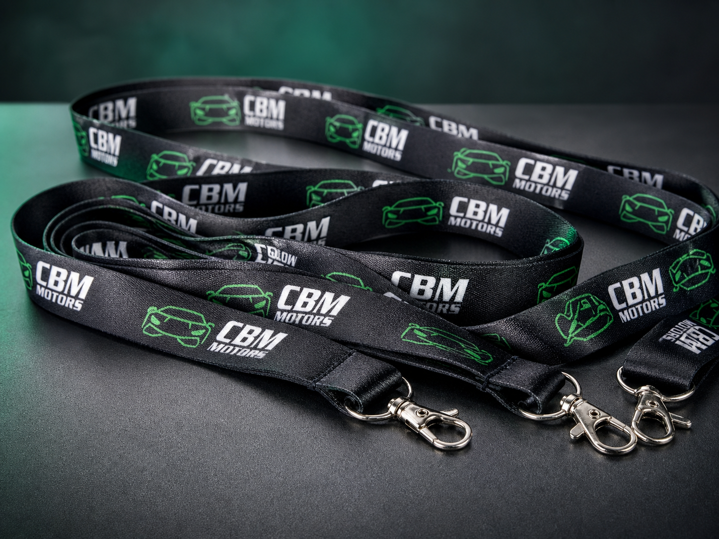 Custom CBM Motors business lanyards with repeat full-color branding and swivel clips