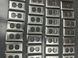 Batch of black stainless-steel switch plates marked with fiber laser engraving