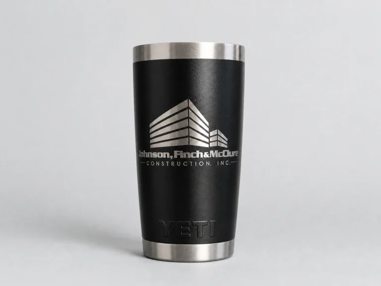 Black YETI tumbler laser engraved with the Johnson, Finch and McClure Construction logo